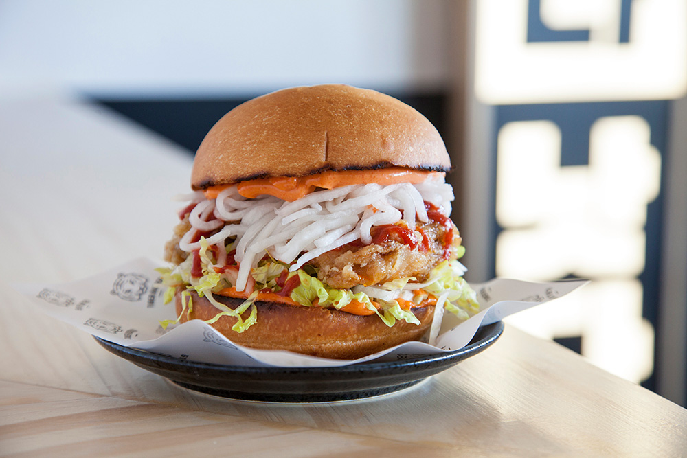 Gang-Jeong: double-fried chicken thigh, chilli-soy glaze, pickled daikon, lettuce, sriracha and chilli mayo.