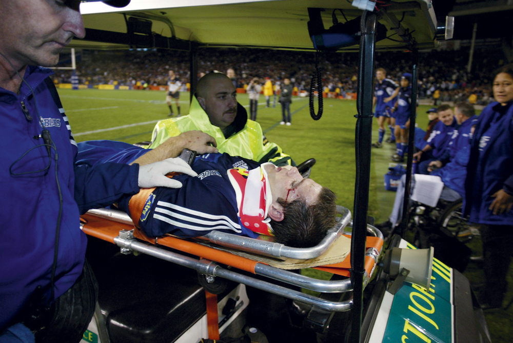 Blues player Steve Devine stretchered off Blues Steve Devine stretchered off.