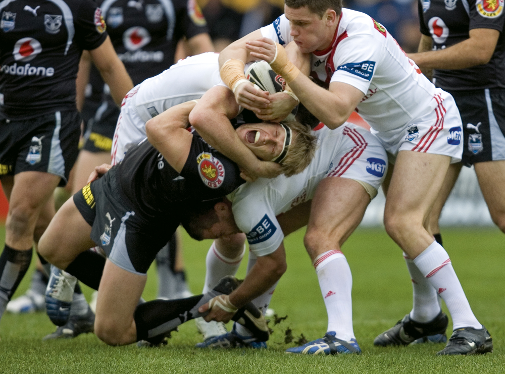 Warriors’ player Micheal Luck is crunched in a tackle.