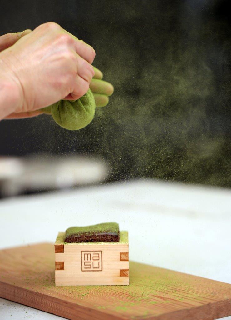 Chocolate pudding with green tea dusting credit Michael Bradley