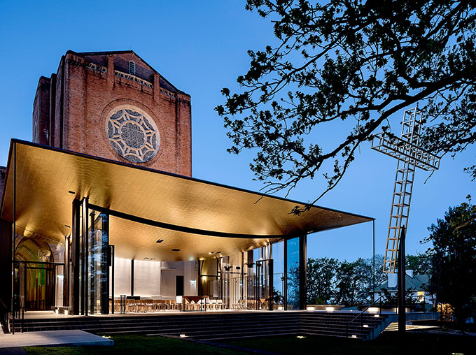 The neo-Gothic chancel and its rose window loom above the cathedral’s new addition.