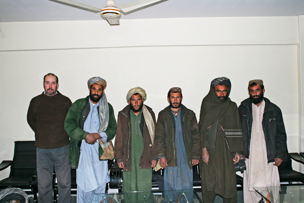 Jon Stephenson (far left) with Band e Timur villagers detained in the 2002 raid. Mohammed Wali is second from left and Abdul Wahid is far right. 