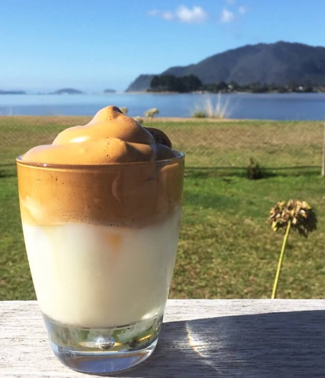 Dalgona cofee against a classic NZ backdrop. Photo: Alex Blackwood
