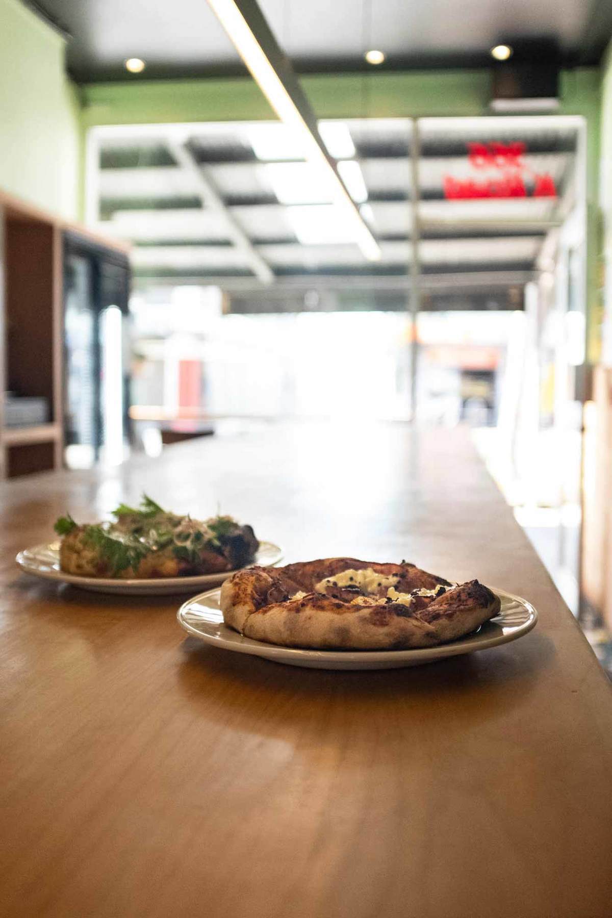 Clay's 'brocolli cooked forever' and mortadella with tomato jam and stracciatella. Photo: Alex Blackwood.