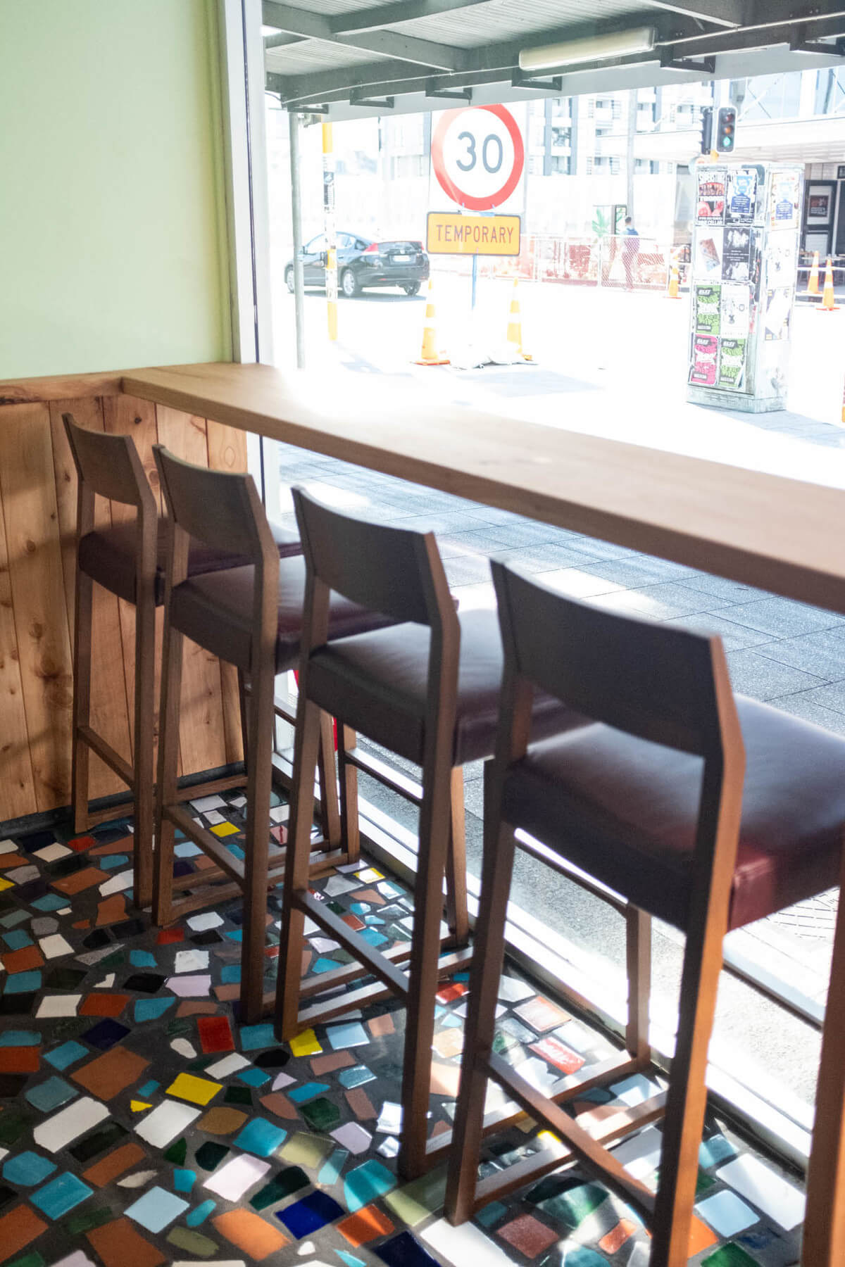The sunny chairs at the font of Clay with the tiled floor beneath them. Photo: Alex Blackwood.