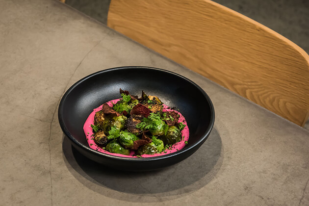 Brussel sprouts with beetroot labneh. Photo: Rebekah Robinson